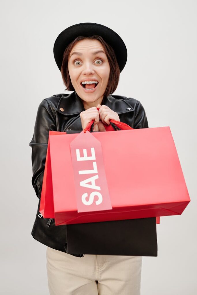 A Happy Woman Holding Shopping Paper Bags